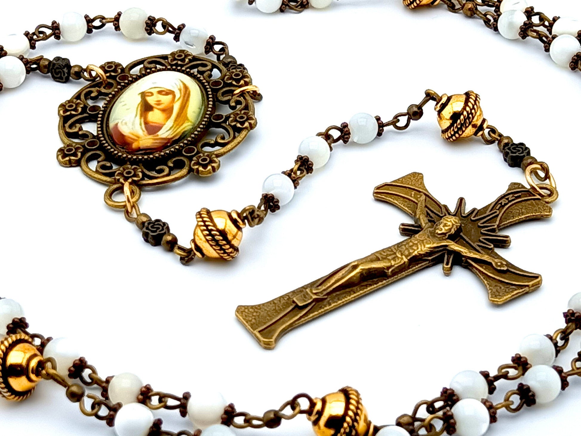Our Lady of Twelve Stars unique rosary beads with mother of pearl and golden beads, bronze crucifix and picture centre medal.