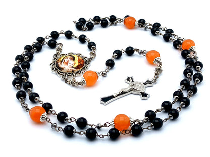 Our Lady of Laus unique rosary beads with black onyx gemstone and tangerine glass beads, black enamel crucifix and silver picture centre medal.