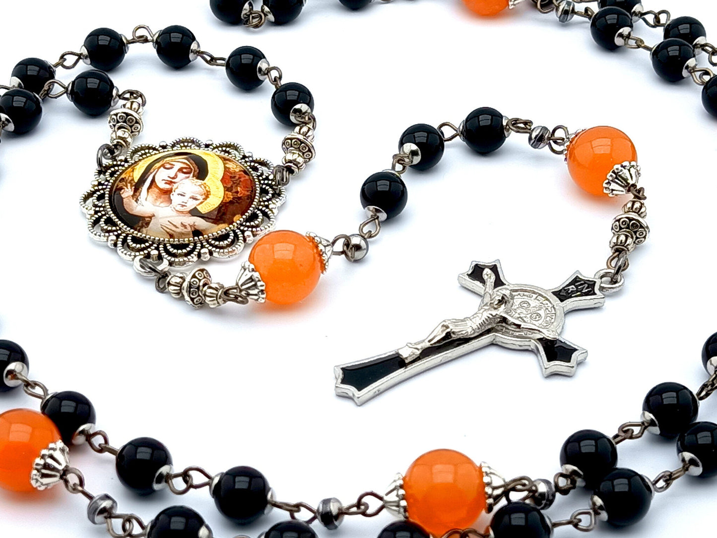 Our Lady of Laus unique rosary beads with black onyx gemstone and tangerine glass beads, black enamel crucifix and silver picture centre medal.
