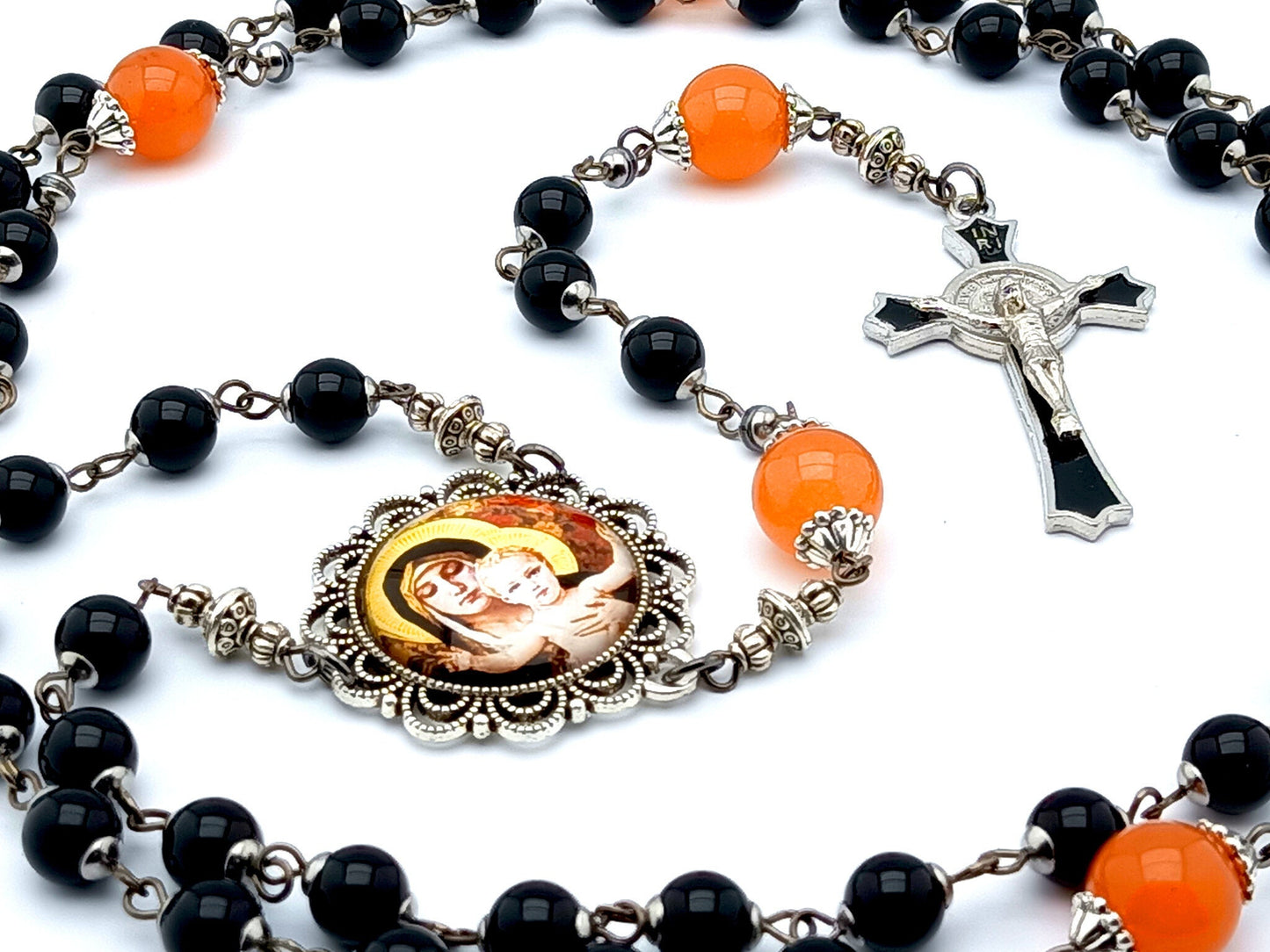 Our Lady of Laus unique rosary beads with black onyx gemstone and tangerine glass beads, black enamel crucifix and silver picture centre medal.