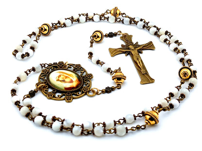 Our Lady of Twelve Stars unique rosary beads with mother of pearl and golden beads, bronze crucifix and picture centre medal.