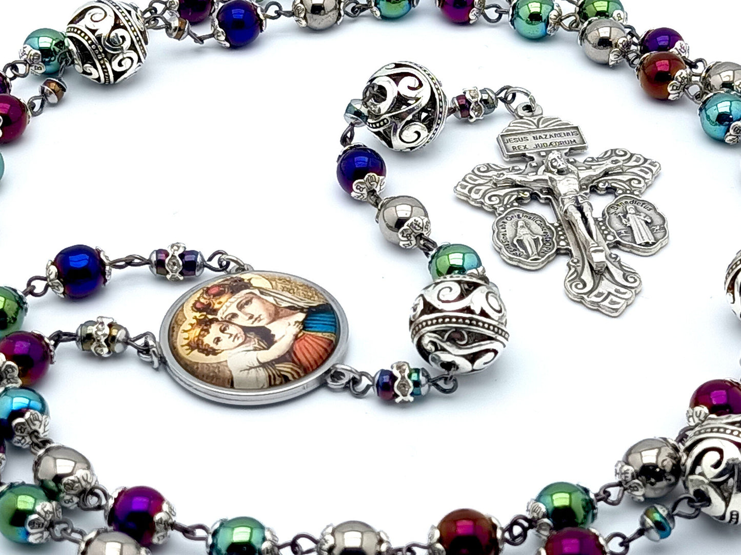 Our Lady Helper of Christians unique rosary beads with multi coloured hematite and silver beads, silver pardon crucifix and stainless steel picture centre medal.