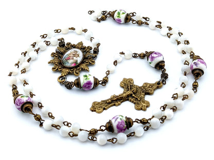 Our Lady of Perpetual Succour unique rosary beads with mother of pearl and porcelain beads, bronze crucifix, picture centre medal and accessories.