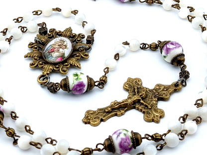 Our Lady of Perpetual Succour unique rosary beads with mother of pearl and porcelain beads, bronze crucifix, picture centre medal and accessories.