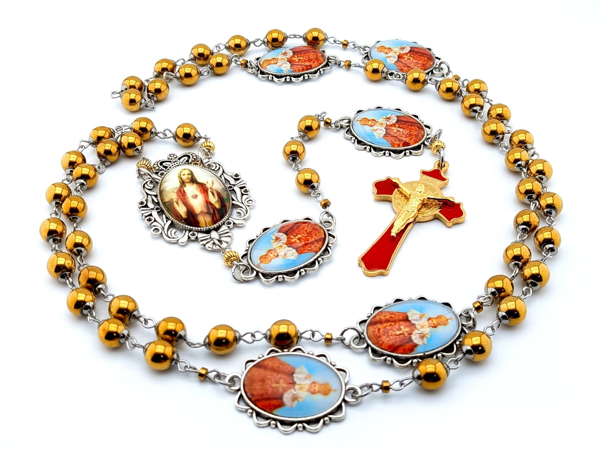 Infant of Prague unique rosary beads with gold hematite gemstone beads, Infant of Prague pater beads, gold and red enamel crucifix and silver picture centre medal.