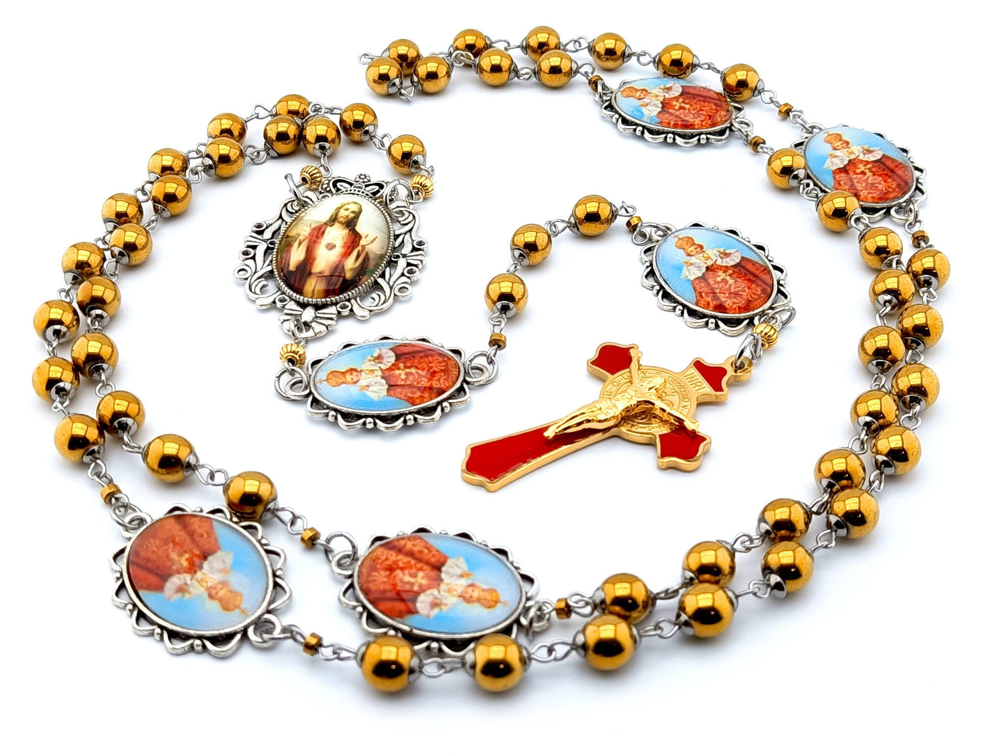 Infant of Prague unique rosary beads with gold hematite gemstone beads, Infant of Prague pater beads, gold and red enamel crucifix and silver picture centre medal.