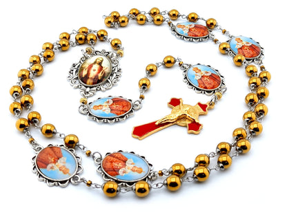 Infant of Prague unique rosary beads with gold hematite gemstone beads, Infant of Prague pater beads, gold and red enamel crucifix and silver picture centre medal.