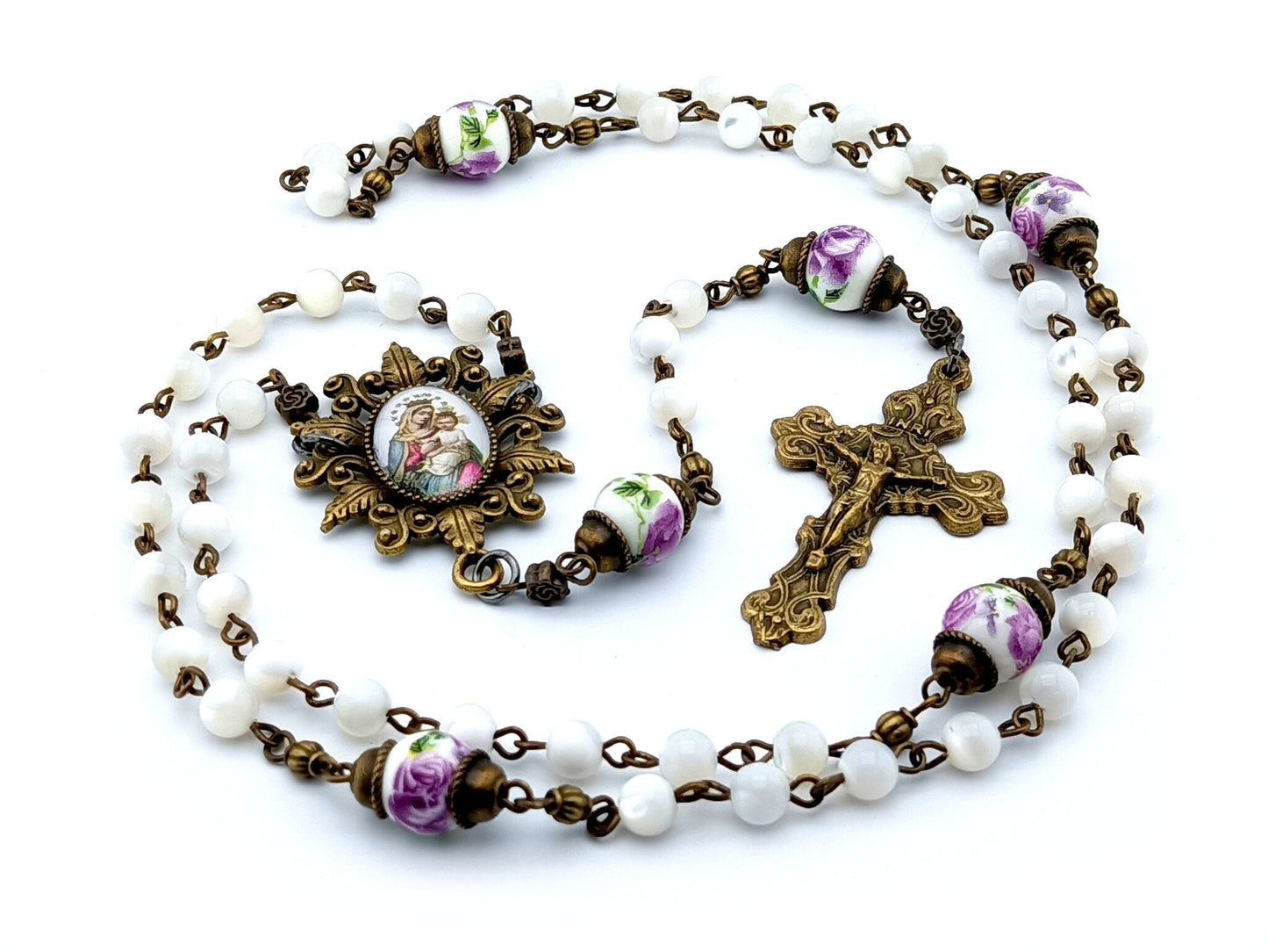 Our Lady of Perpetual Succour unique rosary beads with mother of pearl and porcelain beads, bronze crucifix, picture centre medal and accessories.