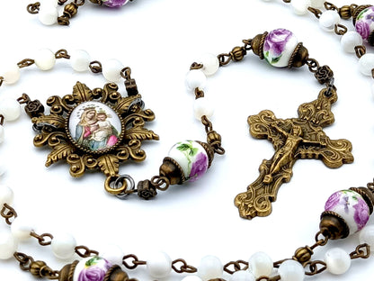 Our Lady of Perpetual Succour unique rosary beads with mother of pearl and porcelain beads, bronze crucifix, picture centre medal and accessories.