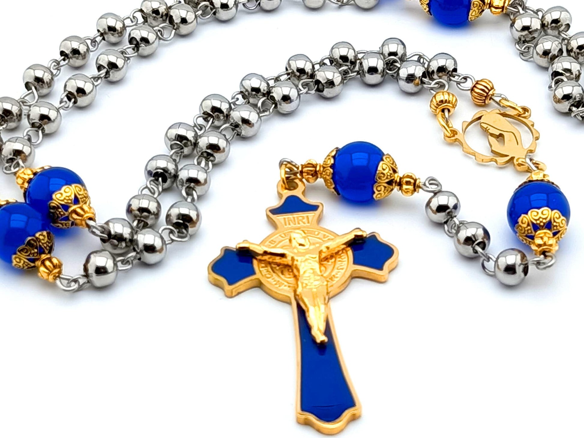 Saint Benedict unique rosary beads with stainless steel and sapphire gemstone beads, gold plated steel blue enamel crucifix and gold plated Virgin Mary centre medal.