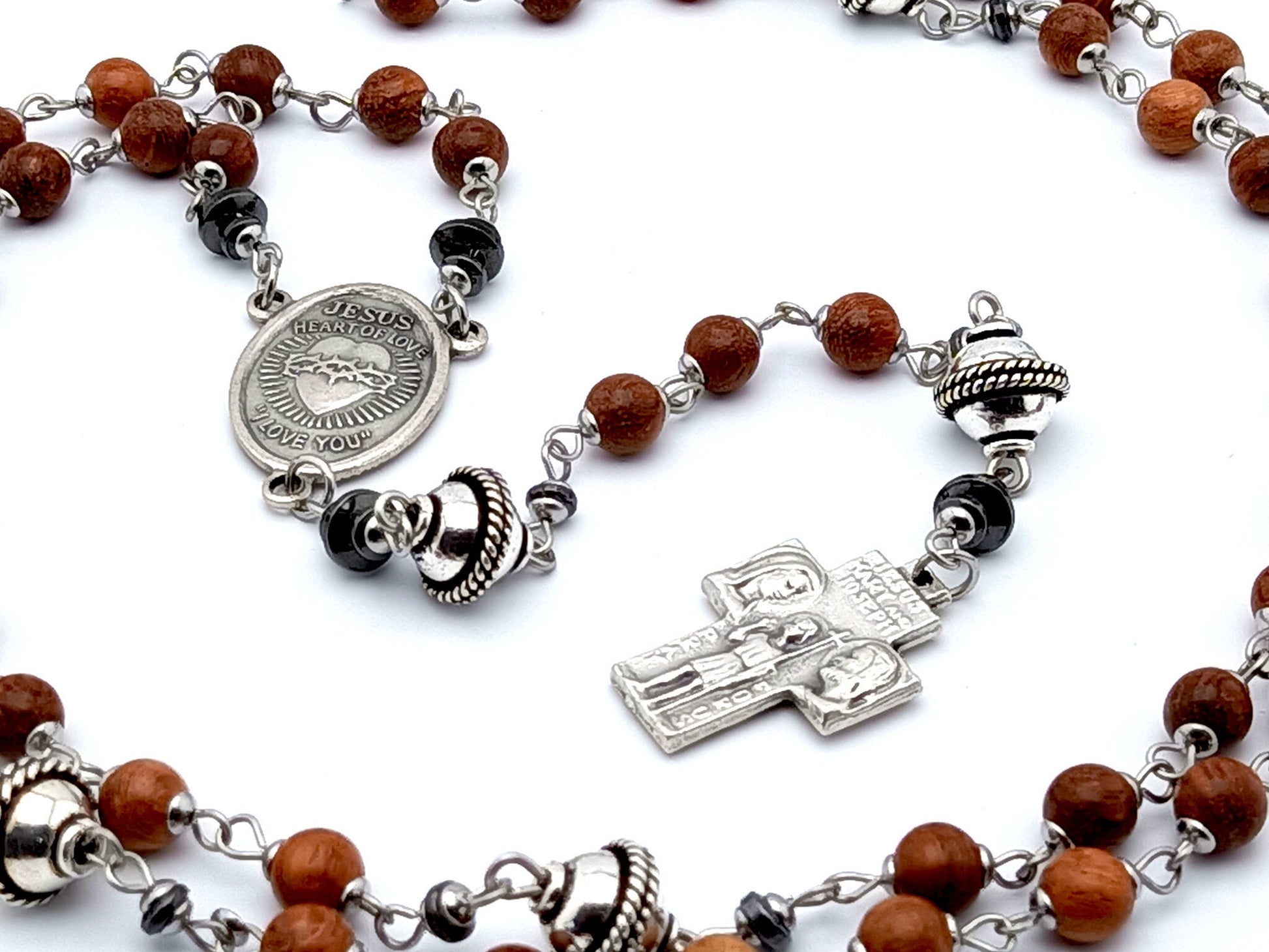 Sacred Heart unique rosaryt beads with dark wood and silver beads, silver Holy Family cross and Sacred Heart centre medal.