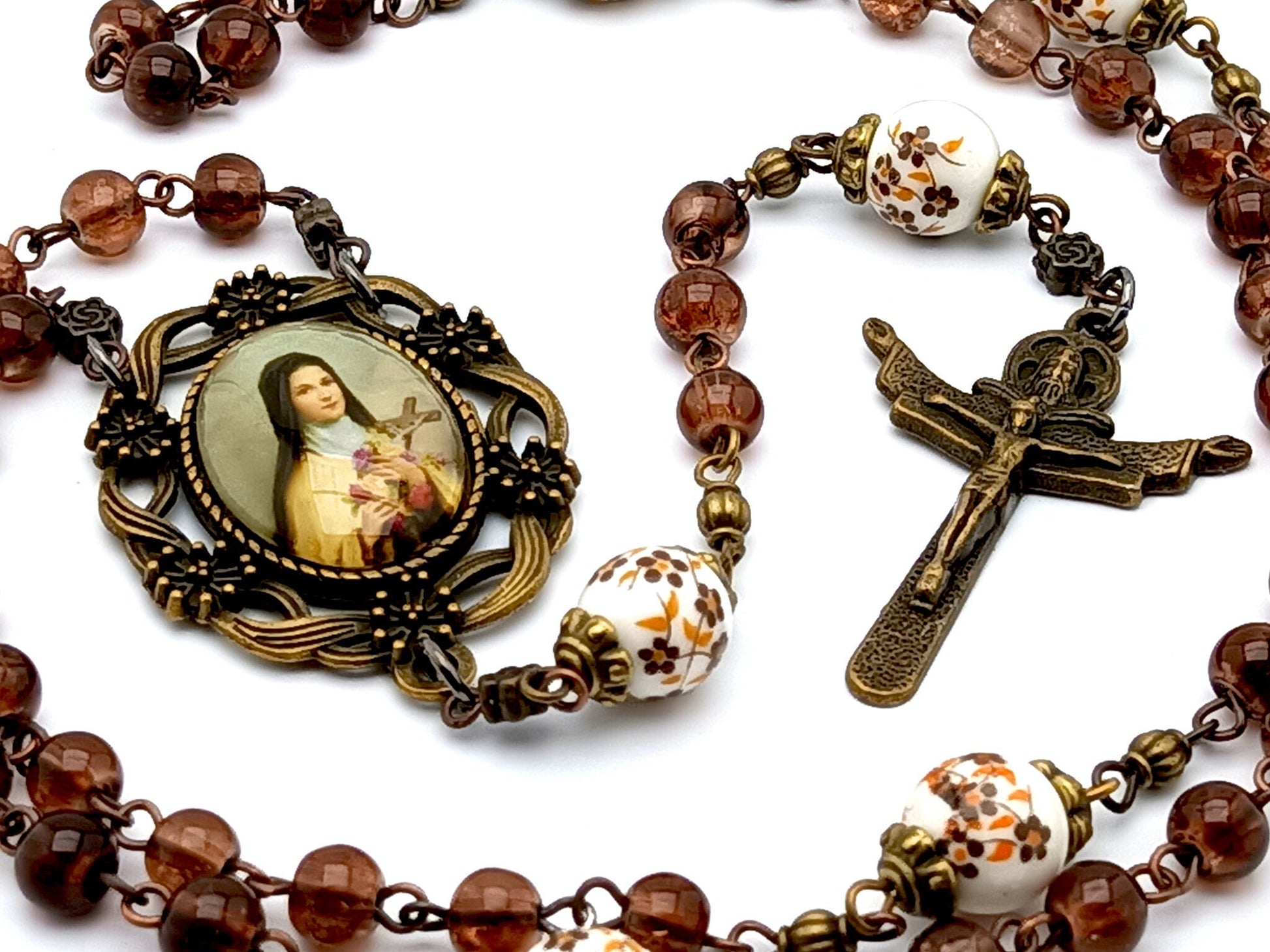 Saint Therese unique rosary beads with dark red glass and floral porcelain beads, bronze Holy Trinity crucifix and  picture centre medal.