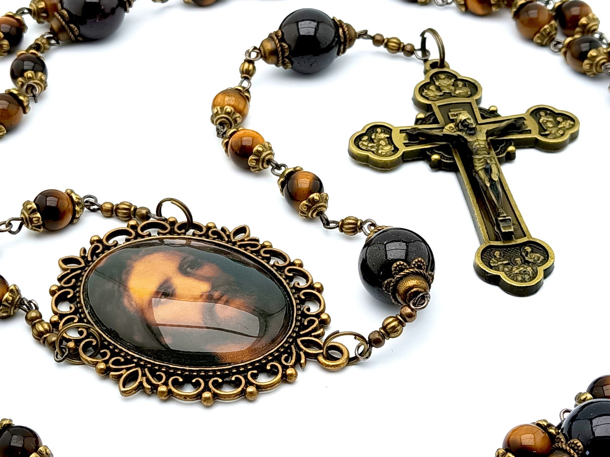 Holy face of Jesus unique rosary beads with tigers eye and garnet gemstone beads, bronze twelve apostles crucifix and Holy face centre medal.