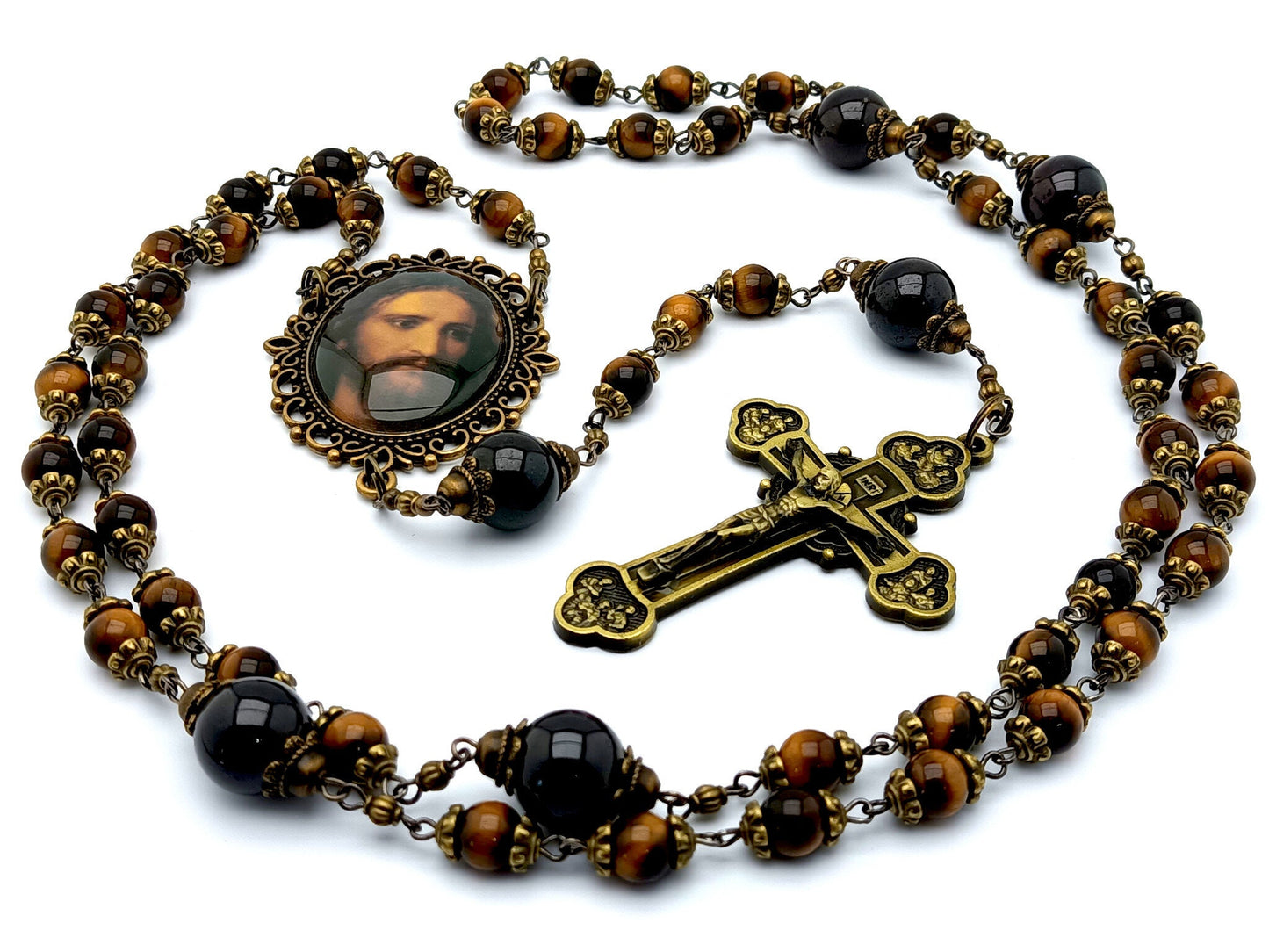 Holy face of Jesus unique rosary beads with tigers eye and garnet gemstone beads, bronze twelve apostles crucifix and Holy face centre medal.