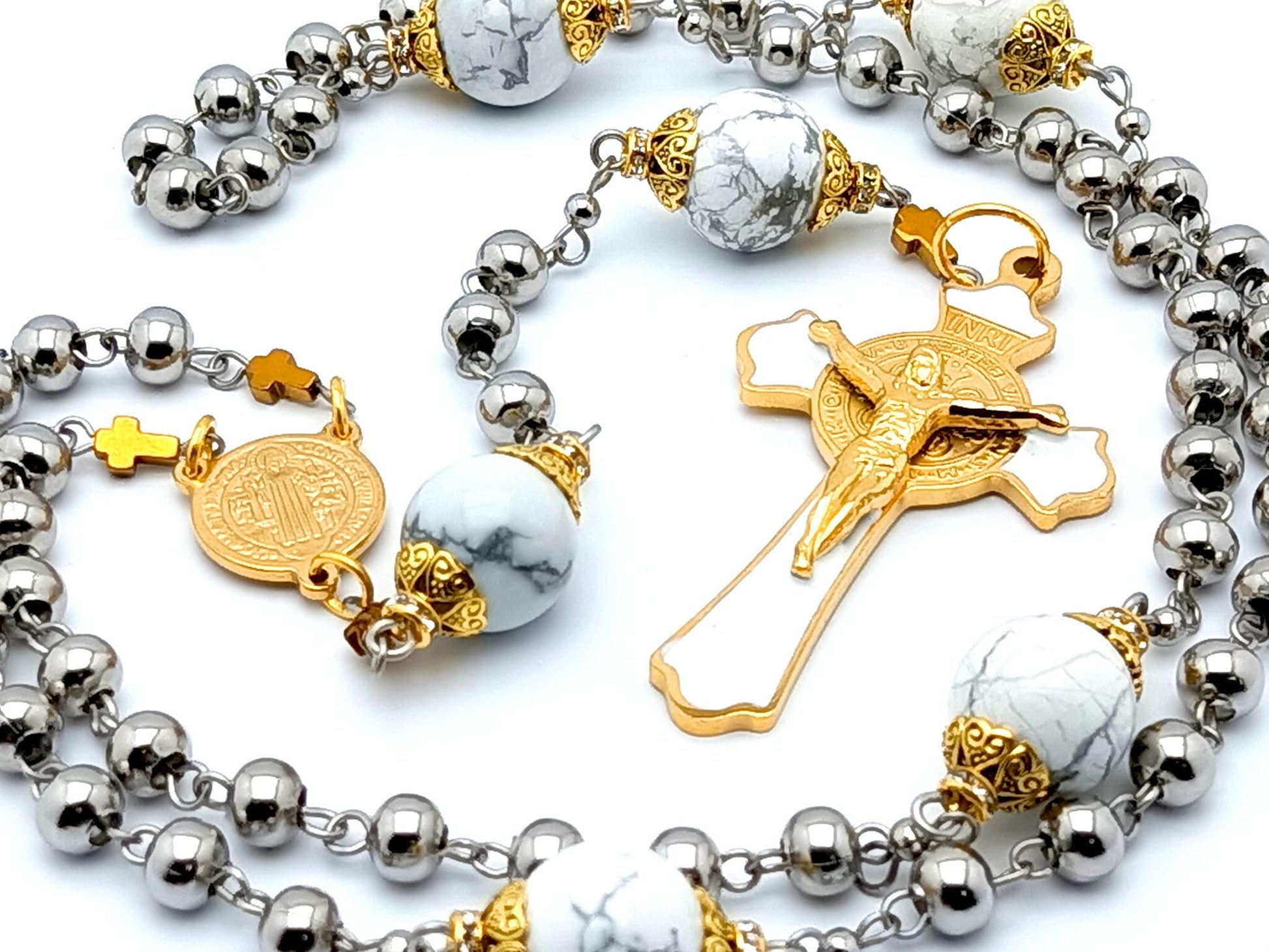 Saint Benedict unique rosary beads with stainless steel and white beads, stainless steel gold plated and white enamel crucifix and gold plated stainless steel centre medal.