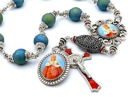 Infant of Prague unique rosary beads single decade rosary with blue green crystal beads, red enamel crucifix and picture centre medal.