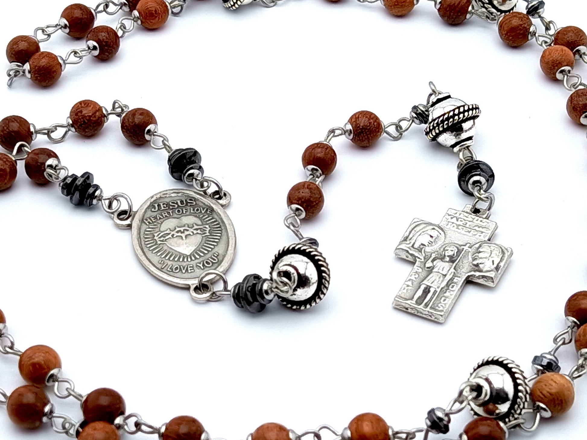 Sacred Heart unique rosaryt beads with dark wood and silver beads, silver Holy Family cross and Sacred Heart centre medal.