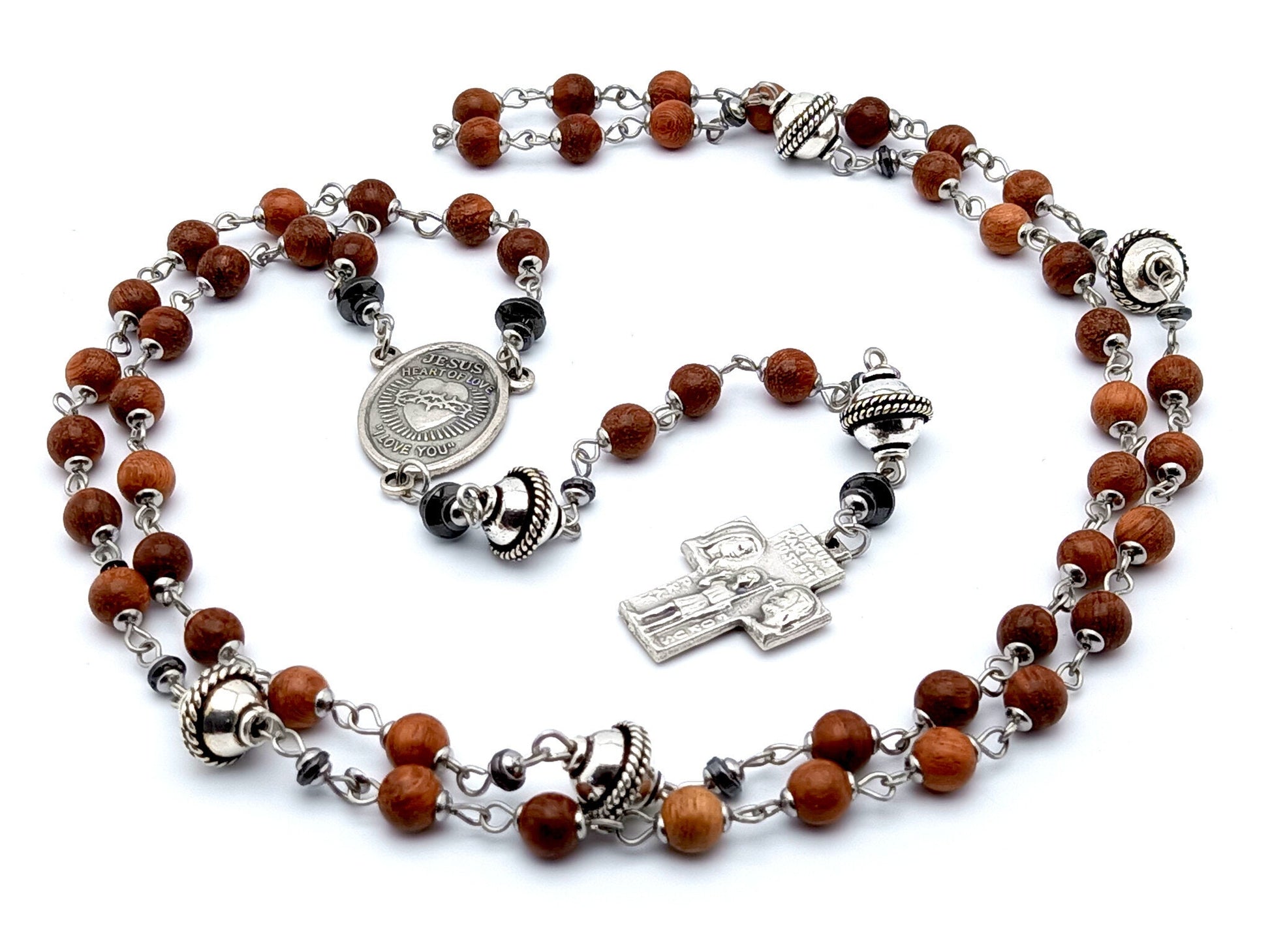 Sacred Heart unique rosaryt beads with dark wood and silver beads, silver Holy Family cross and Sacred Heart centre medal.