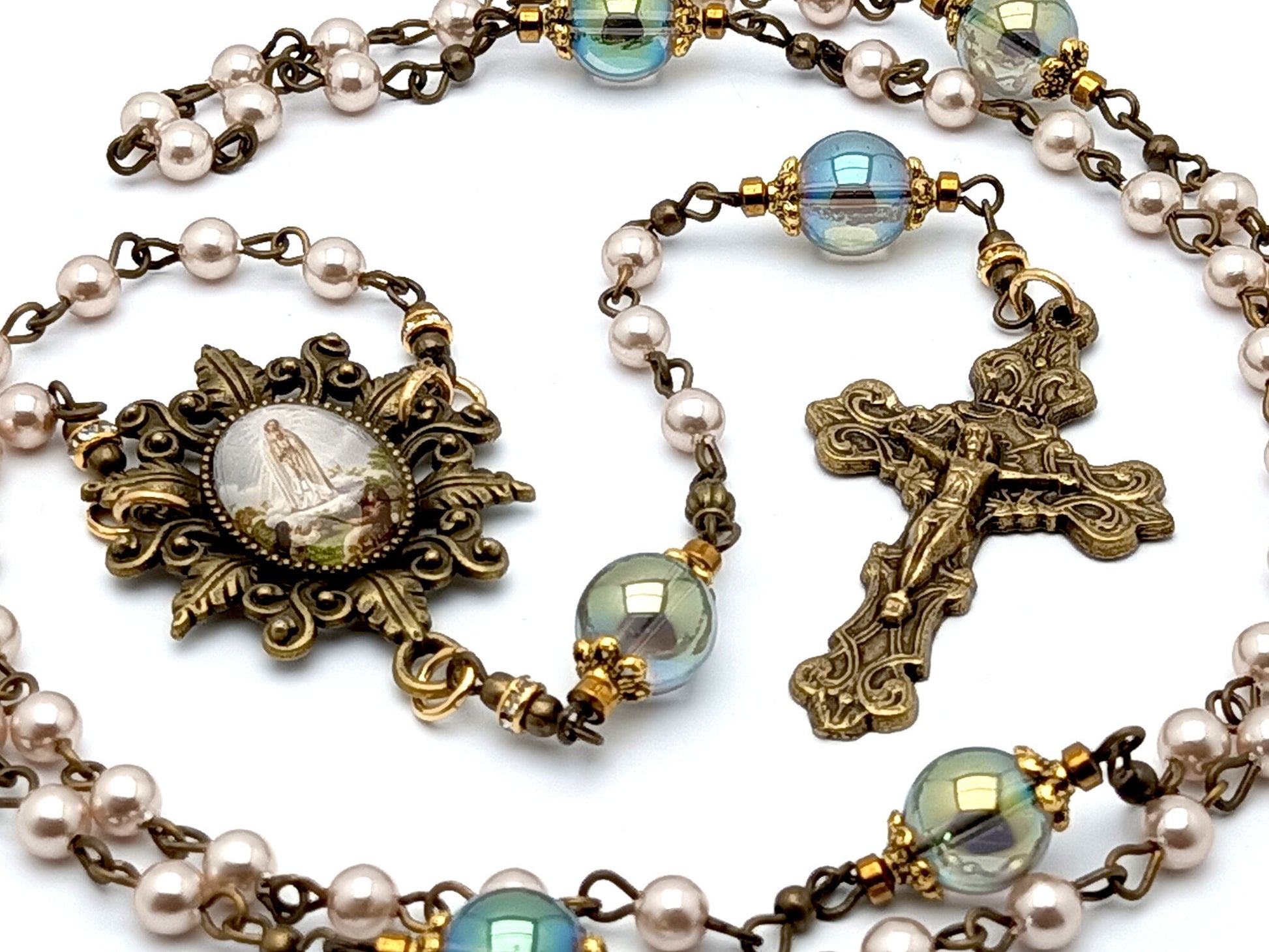 Our Lady of Fatima unique rosary beads with pink pearl and glass beads, bronze crucifix and picture centre medal and accessories.