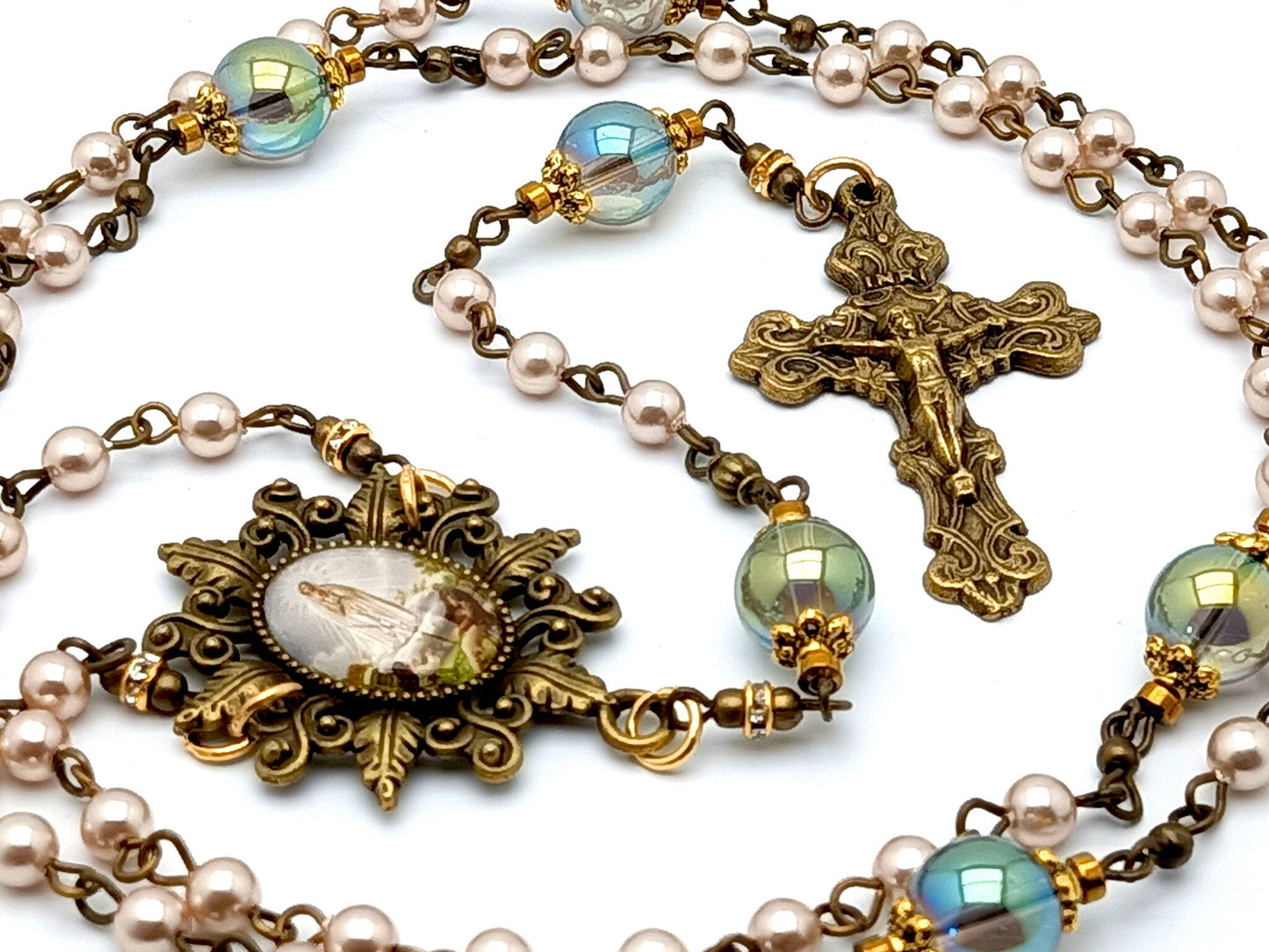 Our Lady of Fatima unique rosary beads with pink pearl and glass beads, bronze crucifix and picture centre medal and accessories.