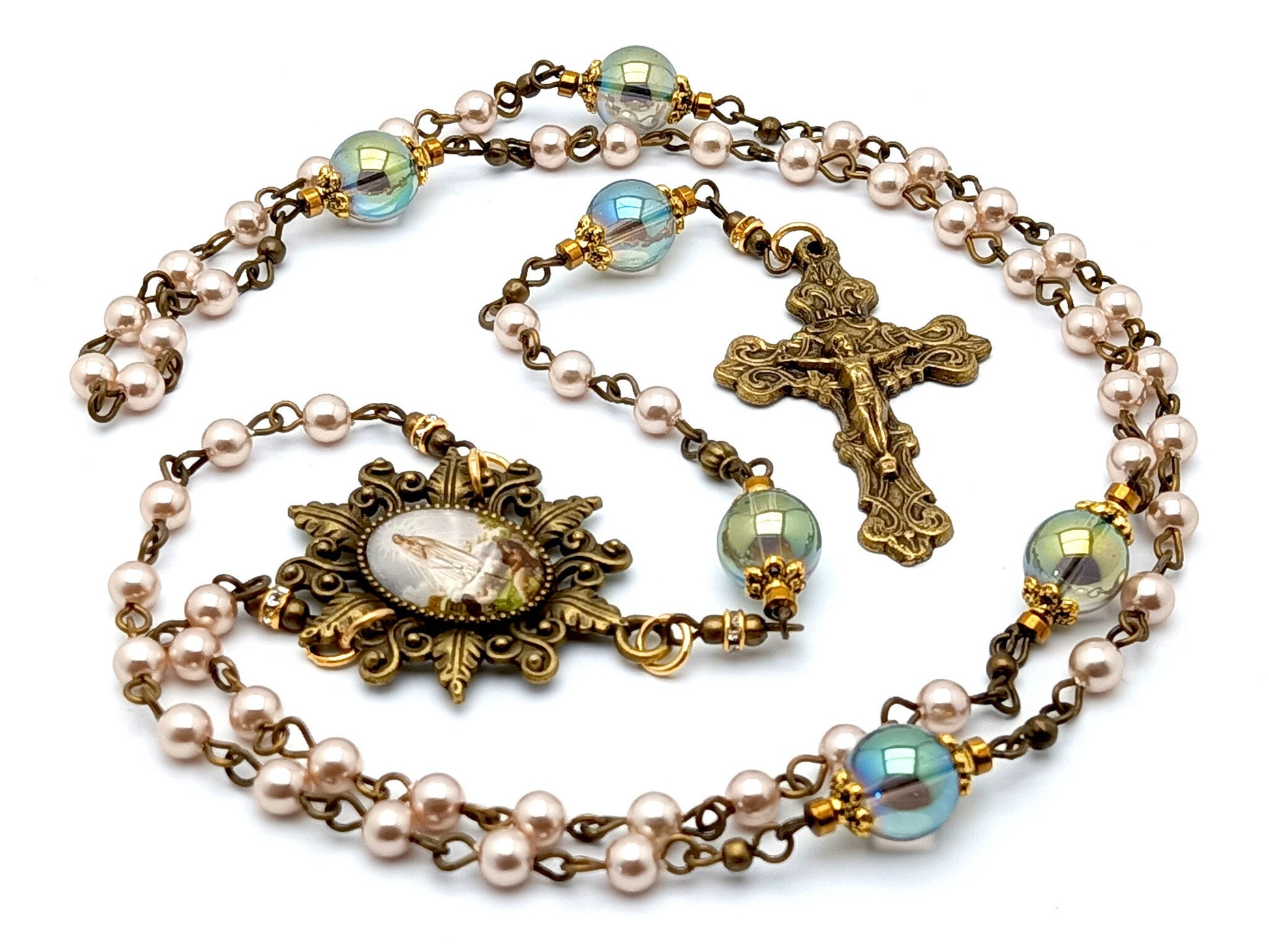 Our Lady of Fatima unique rosary beads with pink pearl and glass beads, bronze crucifix and picture centre medal and accessories.