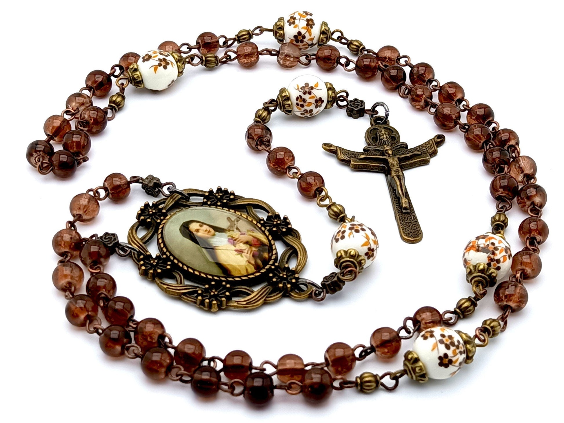 Saint Therese unique rosary beads with dark red glass and floral porcelain beads, bronze Holy Trinity crucifix and  picture centre medal.