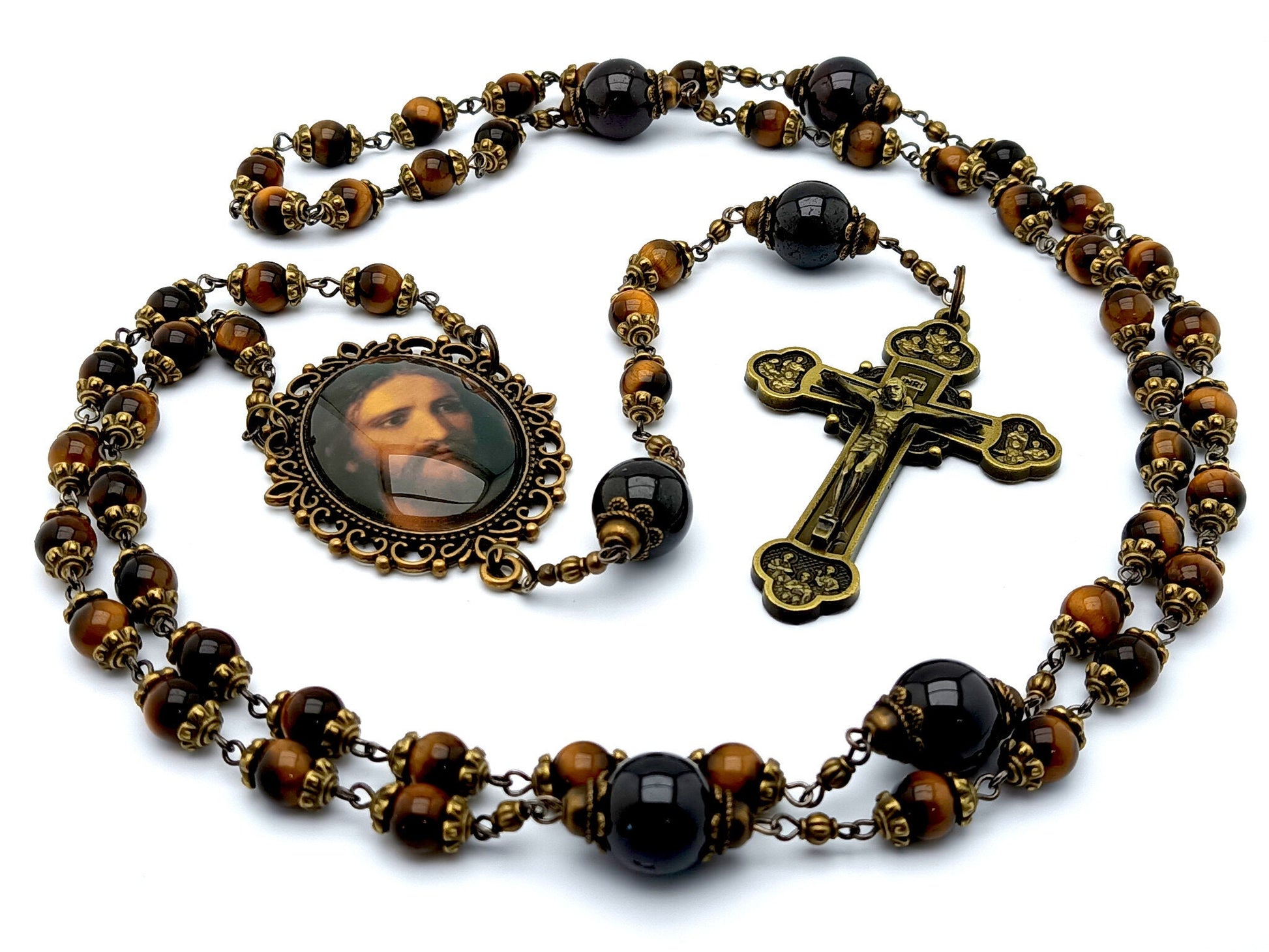 Holy face of Jesus unique rosary beads with tigers eye and garnet gemstone beads, bronze twelve apostles crucifix and Holy face centre medal.