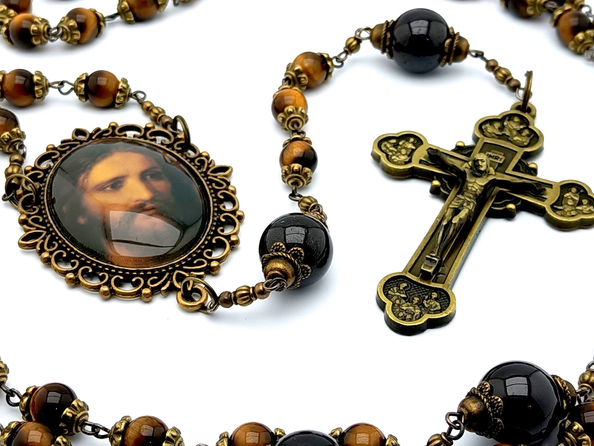 Holy face of Jesus unique rosary beads with tigers eye and garnet gemstone beads, bronze twelve apostles crucifix and Holy face centre medal.