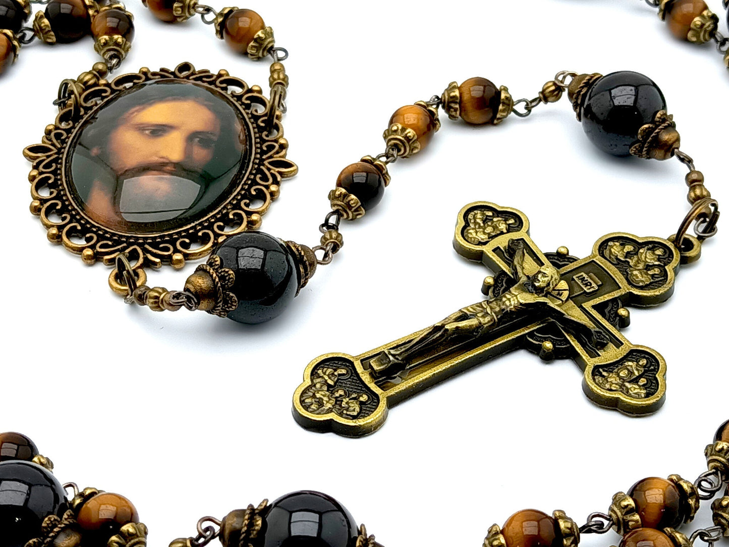 Holy face of Jesus unique rosary beads with tigers eye and garnet gemstone beads, bronze twelve apostles crucifix and Holy face centre medal.