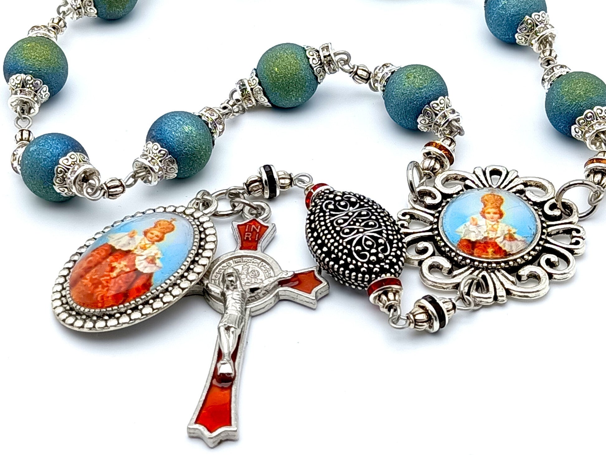Infant of Prague unique rosary beads single decade rosary with blue green crystal beads, red enamel crucifix and picture centre medal.