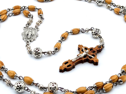 Miraculous medal unique rosary beads with wooden rice shaped beads, silver filigree pater beads, olivewood crucifix and miraculous medal centre. 
