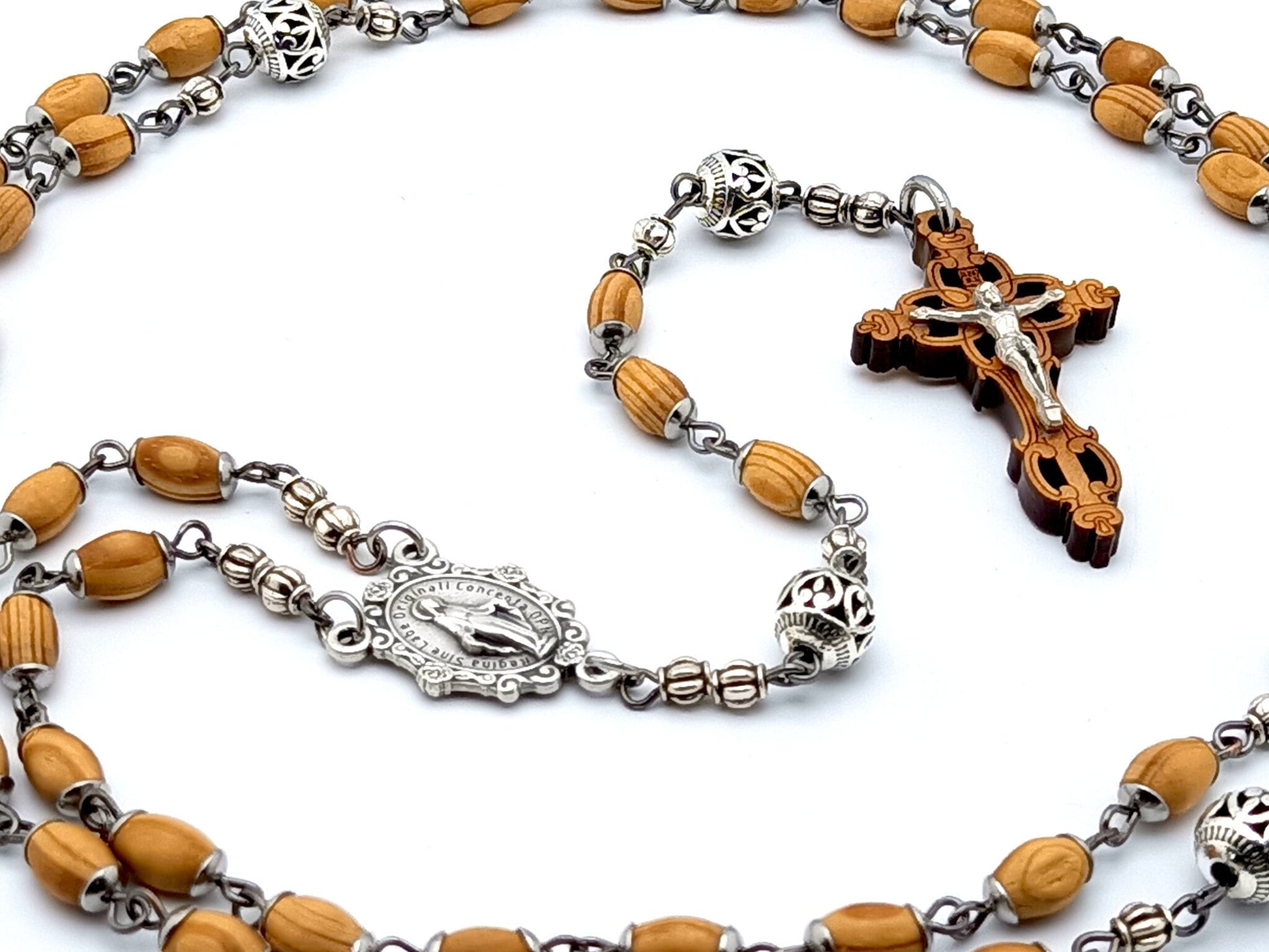 Miraculous medal unique rosary beads with wooden rice shaped beads, silver filigree pater beads, olivewood crucifix and miraculous medal centre. 