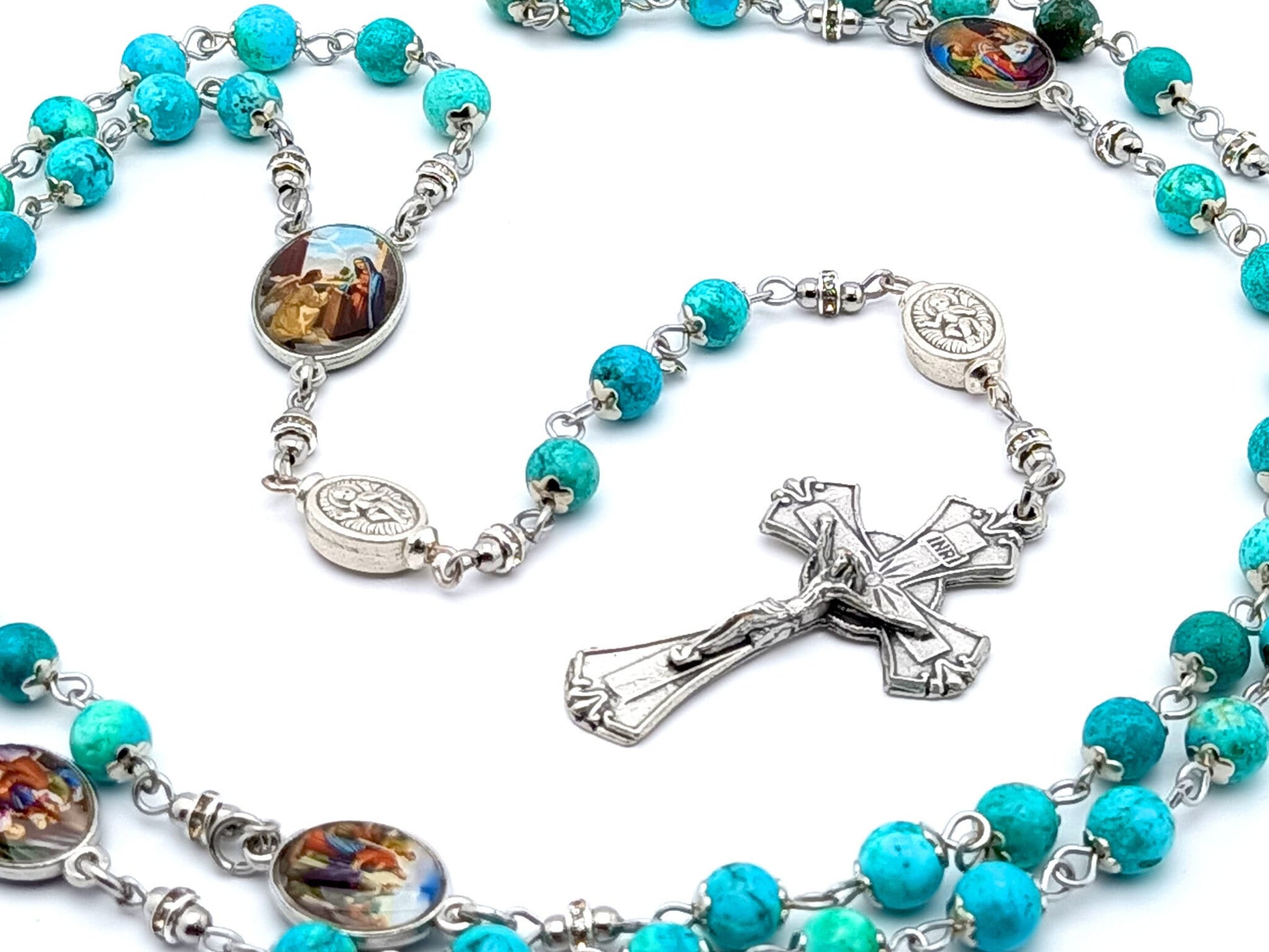 The Golrious Mysteries unique rosary beads with turquoise gemstone and Miraculous medal linking beads, silver crucifix and picture centre medal.