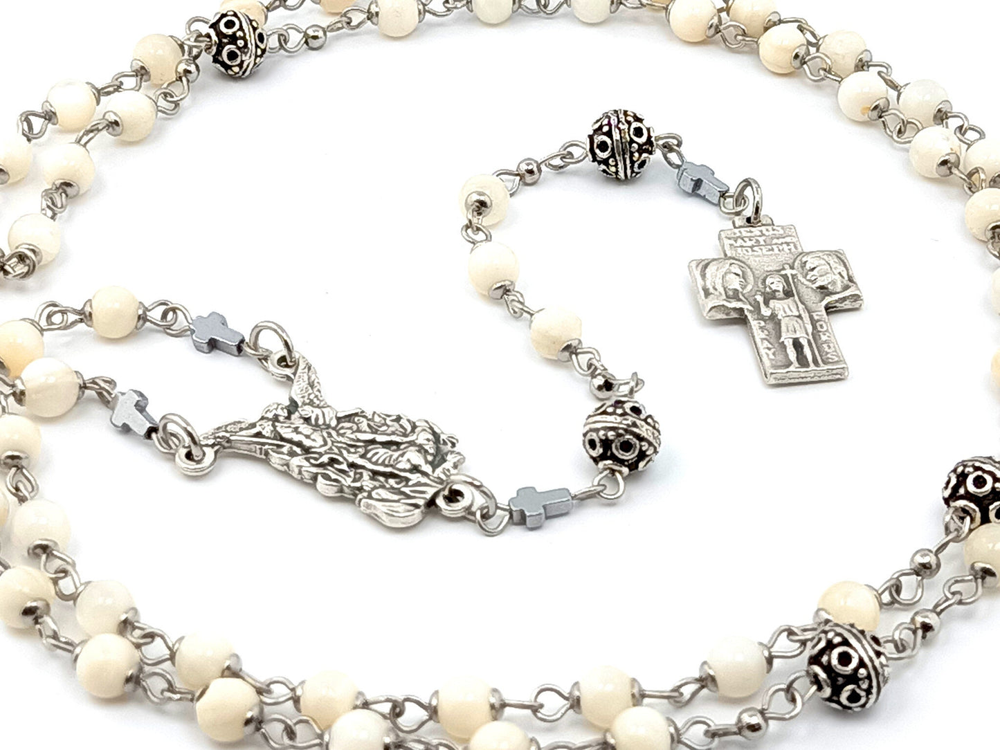 Saint Michael unique rosary beads mother of pearl rosary beads with Saint Christopher and the Holy Family silver cross.