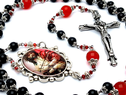 The Crucifixion unique rosary beads with onyx and ruby gemstone beads and stainless steel crucifix.