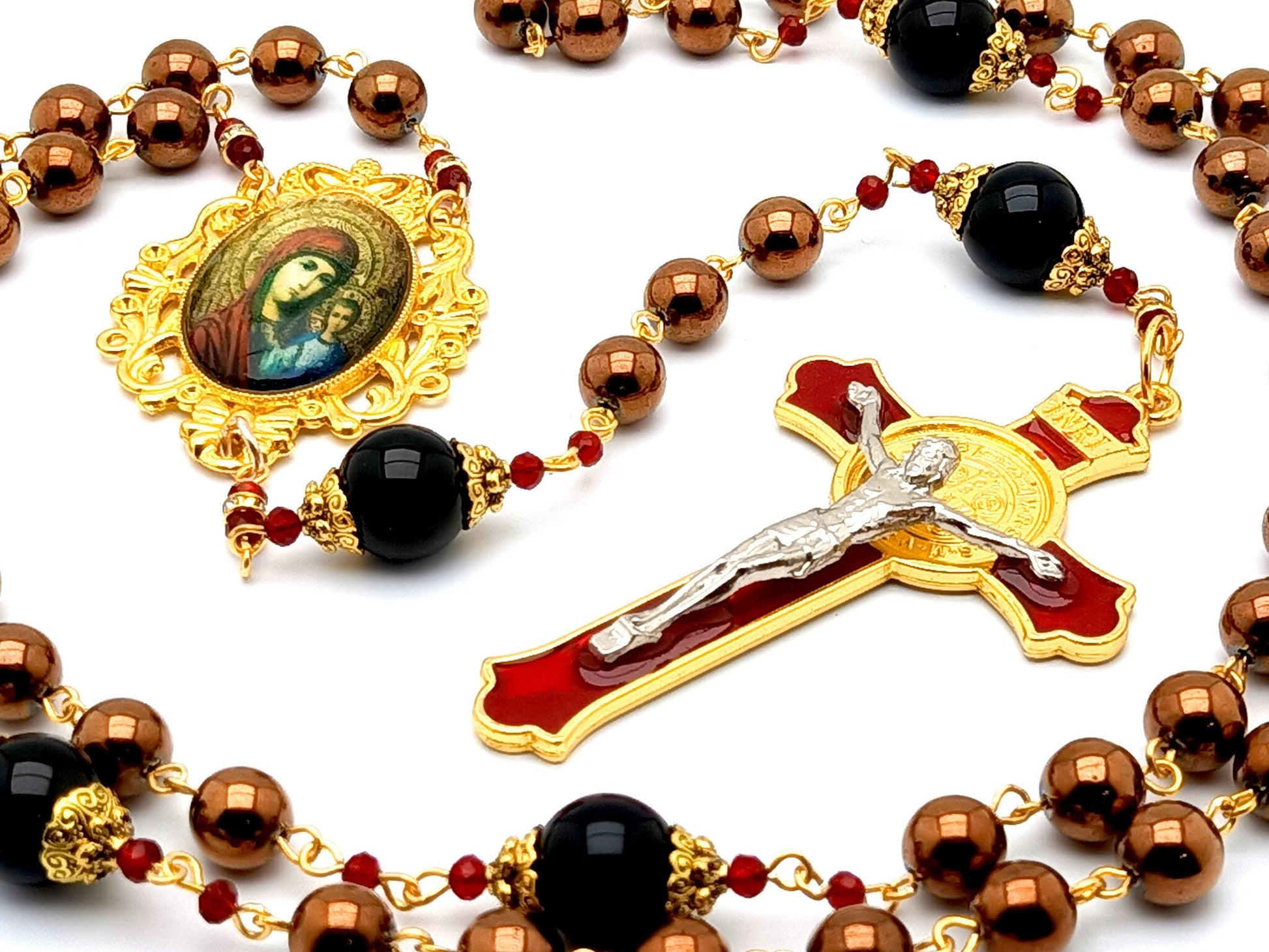 Our Lady of Perpetual Help unique rosary beads with hematite and onyx gemstone beads and red and gold enamel Saint Benedict crucifix.