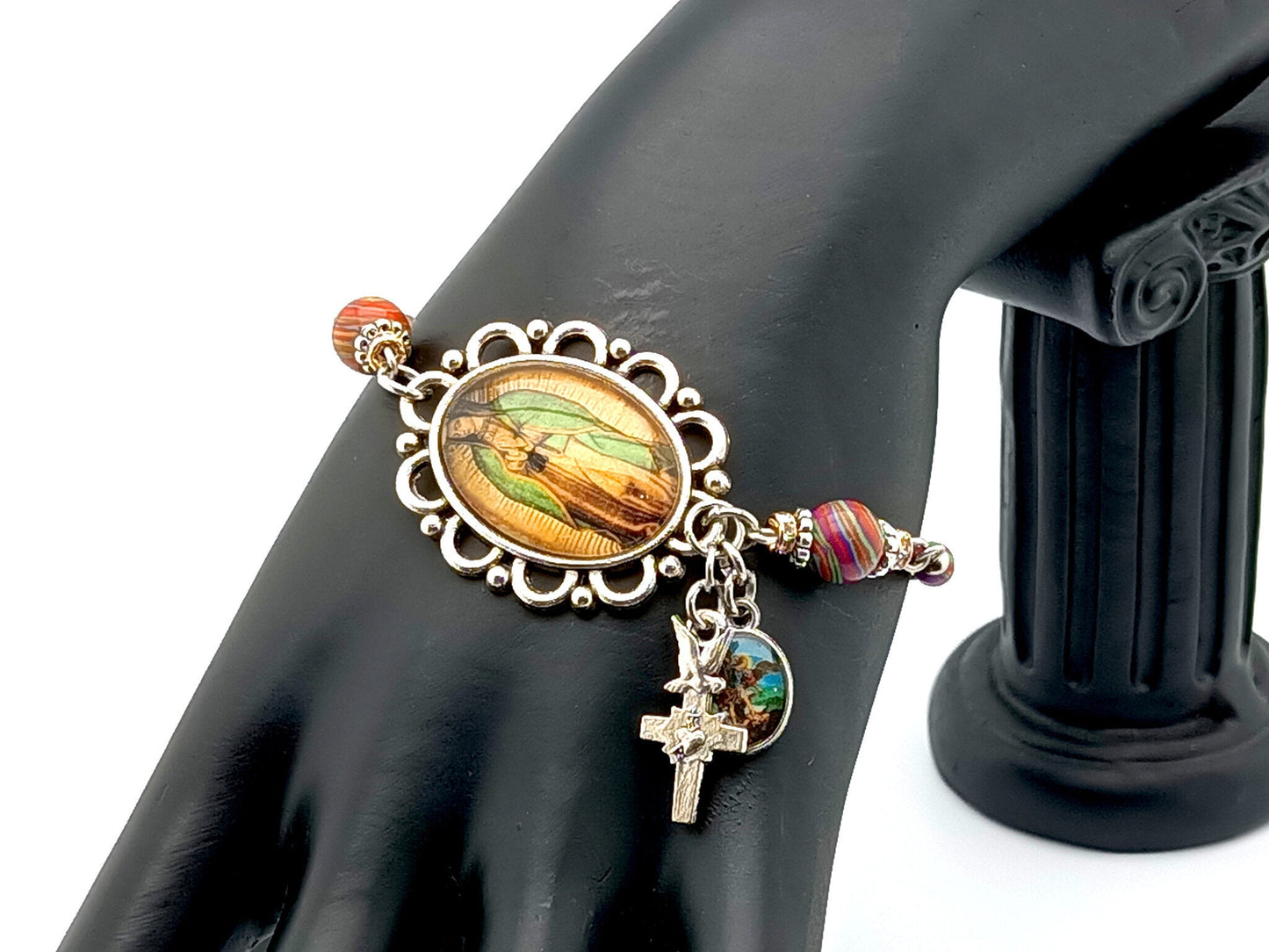 Our Lady of Guadalupe unqie rosary beads adjustable stainless steel bracelet with malachite gemstones and Holy Spirit cross and Saint Michael medal.
