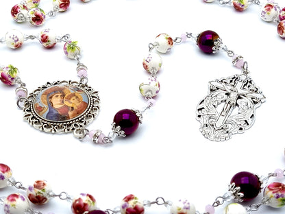 Our Lady of Perpetual Help unique rosary beads with floral porcelain and purple glass beads and Holy Angel crucifix.