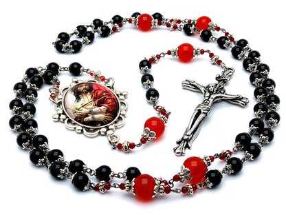 The Crucifixion unique rosary beads with onyx and ruby gemstone beads and stainless steel crucifix.