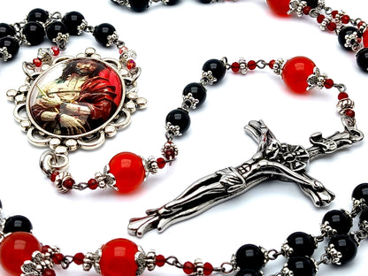 The Crucifixion unique rosary beads with onyx and ruby gemstone beads and stainless steel crucifix.