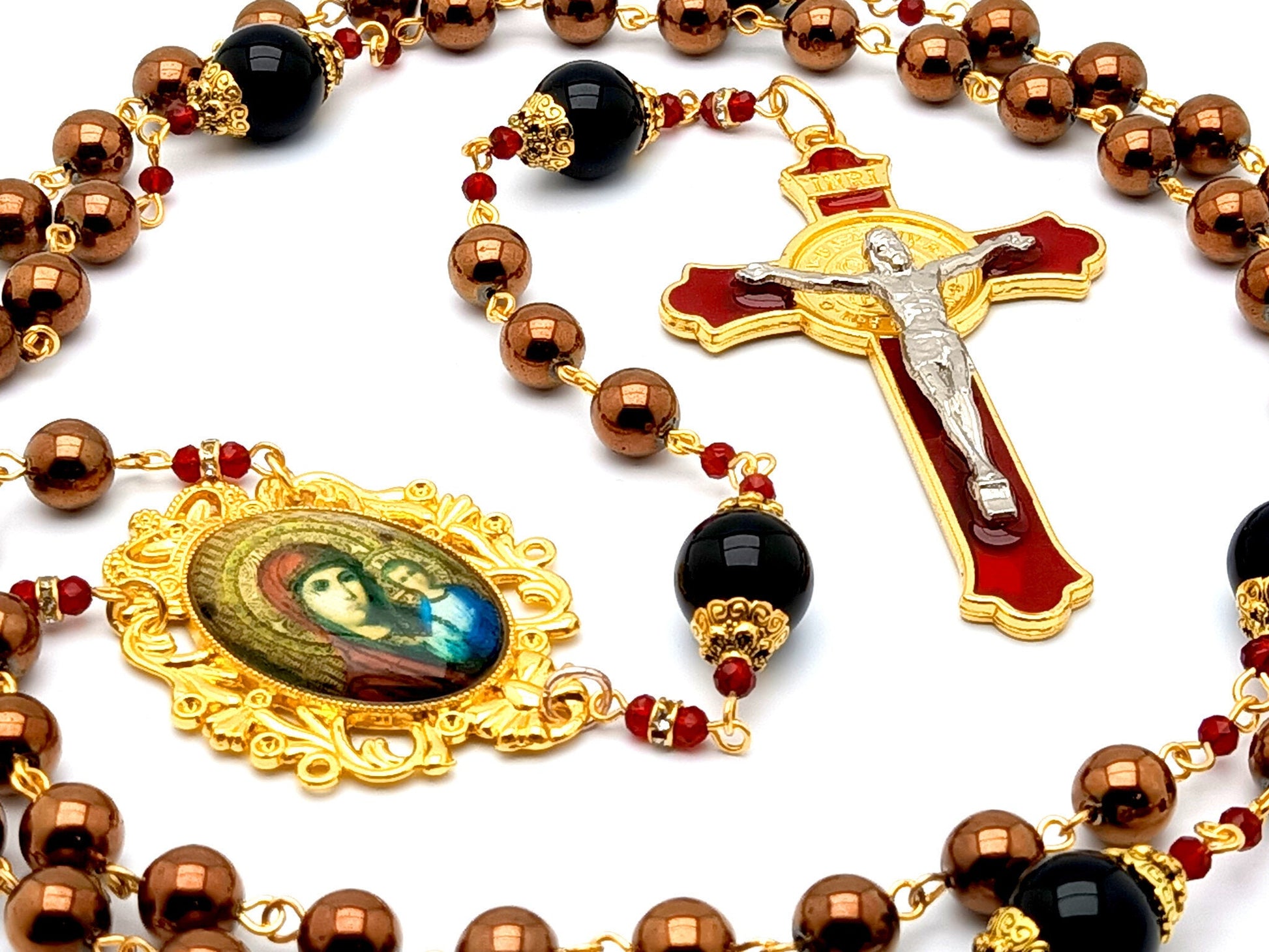 Our Lady of Perpetual Help unique rosary beads with hematite and onyx gemstone beads and red and gold enamel Saint Benedict crucifix.