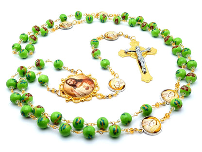 Sacred Heart of Jesus unique rosary beads with floral porcelain and the Virgin Mary linking medal beads and gold Saint Benedict crucifix.